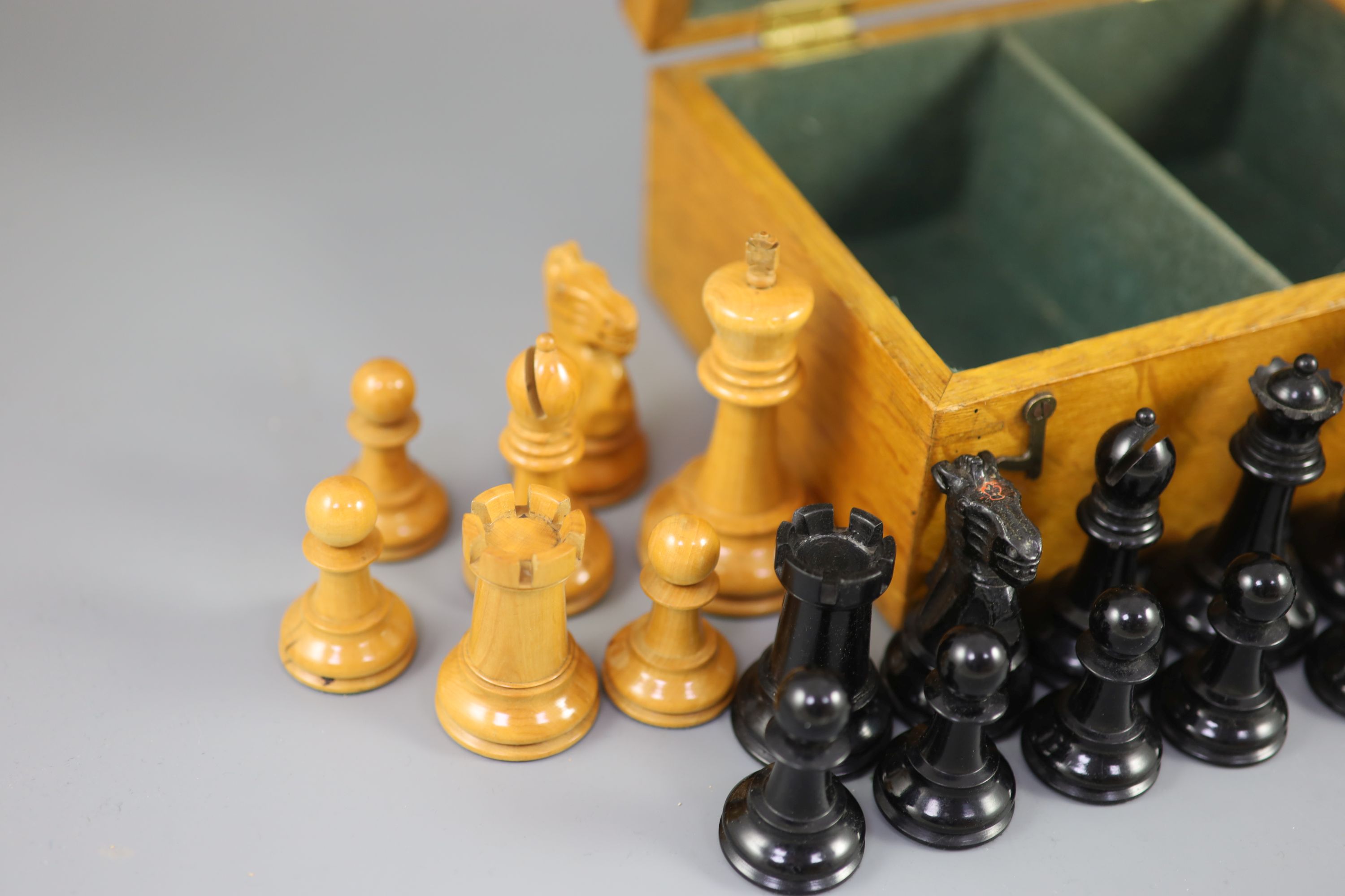 A Jaques & Son Staunton 3 1/2 boxwood and weighted chess set in original golden oak box, c.1910, 8 x 5.75 x 3.5in.